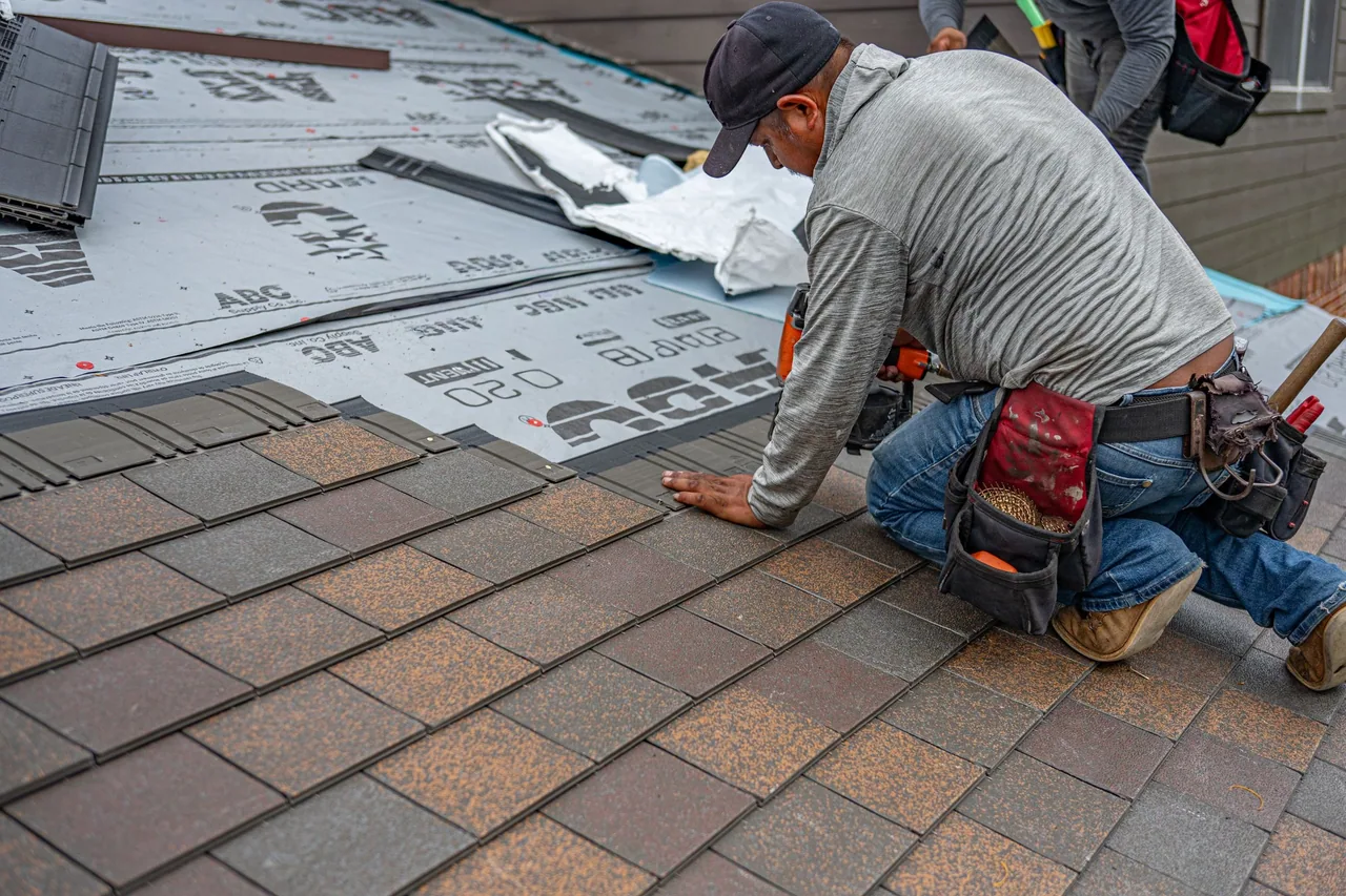 Roofing materials being installed on a residential roof